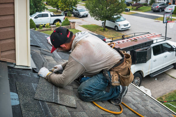 Professional Gutter Installation technician working in Charlestown, MA